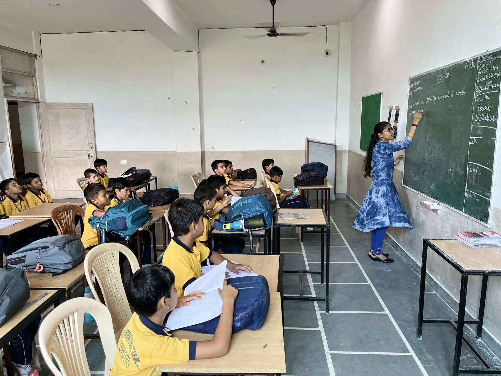 A teacher leading a lesson in a full classroom