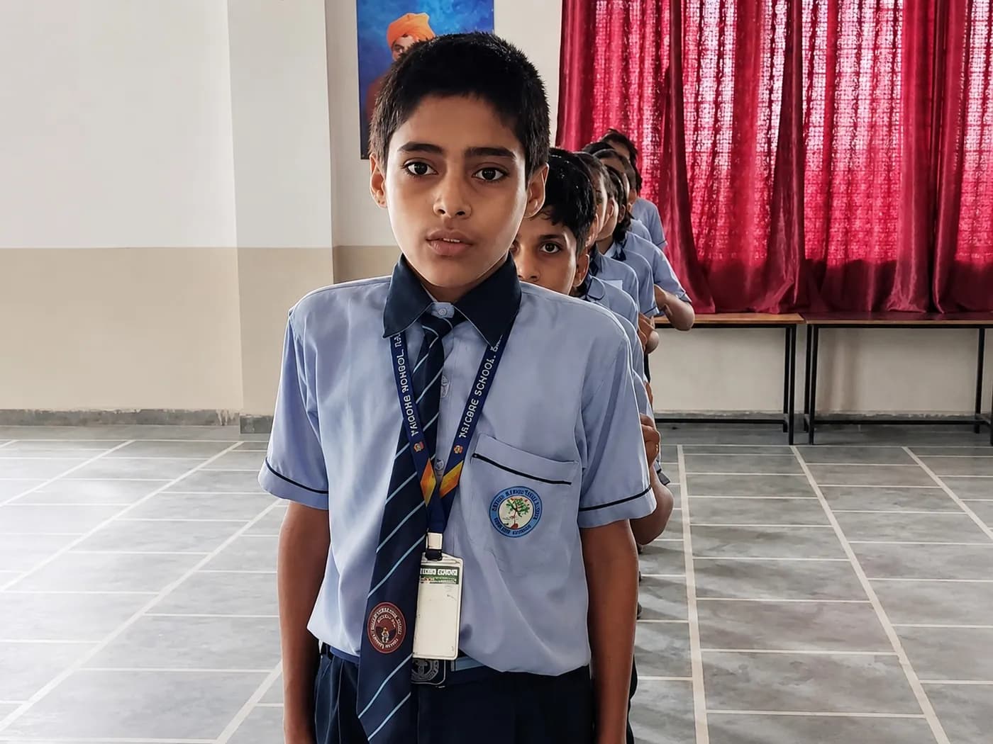 A pupil of Newton Global School at assembly