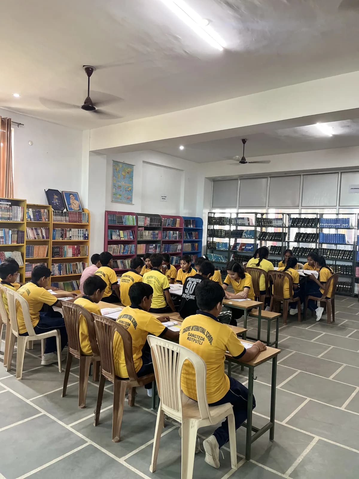 Pupils reading at the tables in the school library