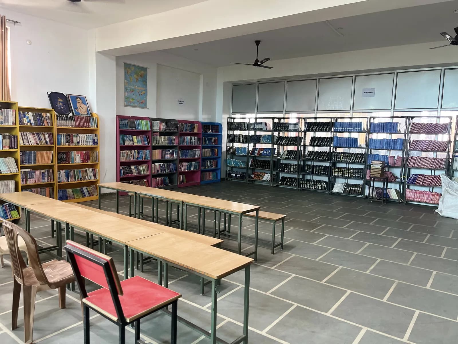 The school library with its reading tables and shelves