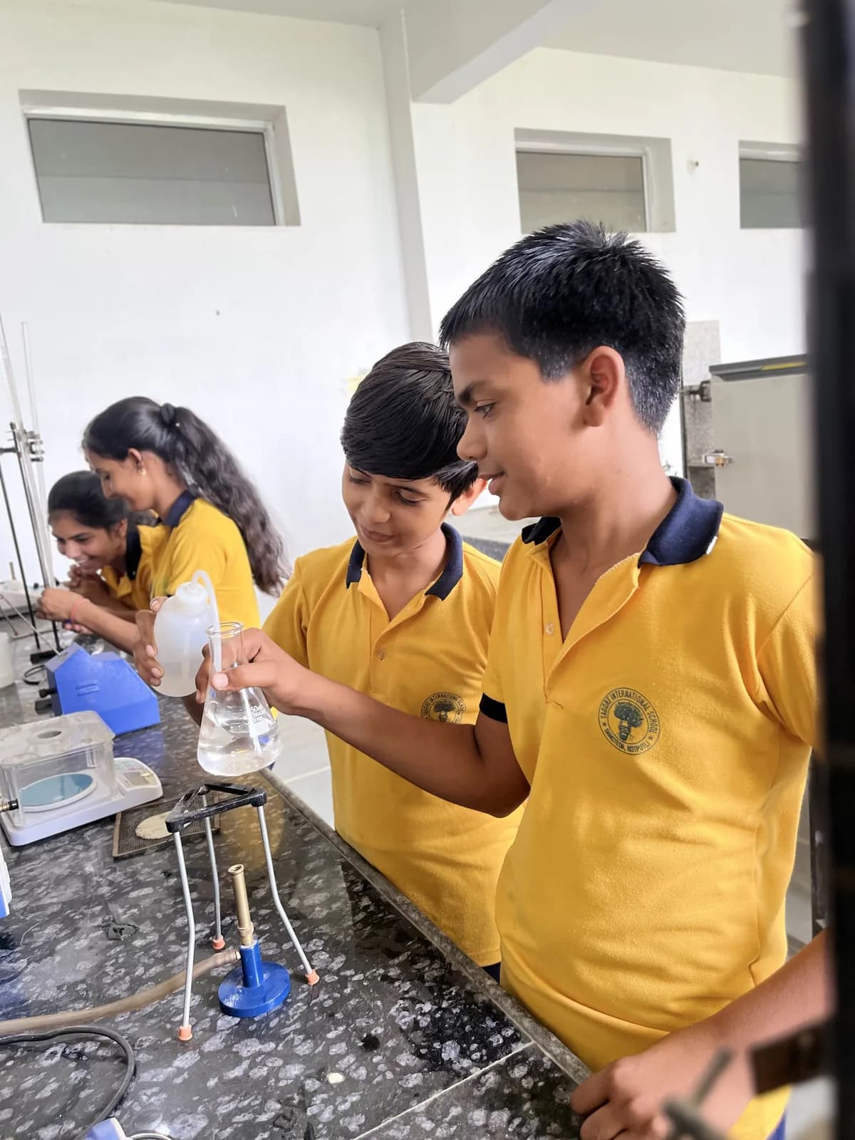 Pupils carrying out an experiment in the science lab