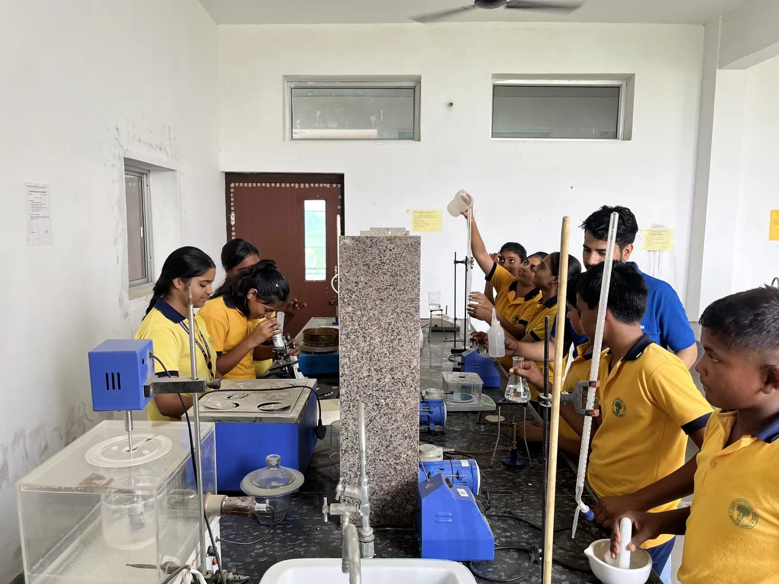 Pupils at the benches in the science laboratory
