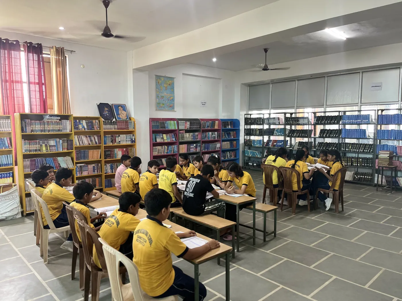 Pupils reading together in the library